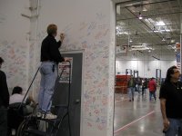 Ron signing Shelby's wall.JPG
